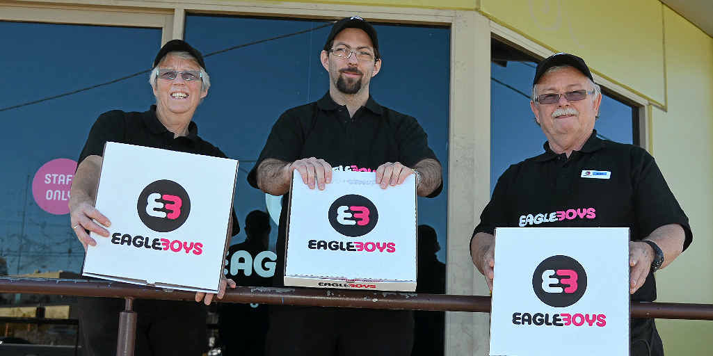 Warwick Eagle Boys owners Robyn, Anthony and John Rye show off their creative new branding as they celebrate being named in the top four stores in the country. 